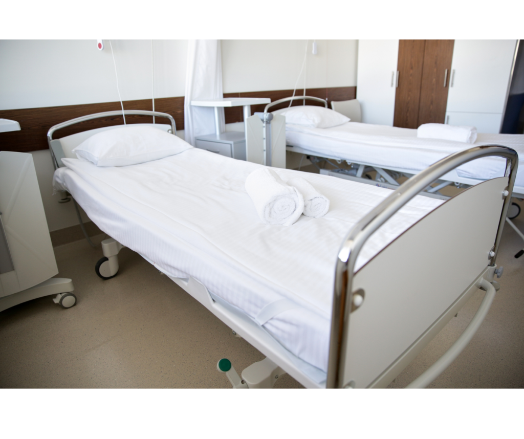 Hospital ward with clean empty beds